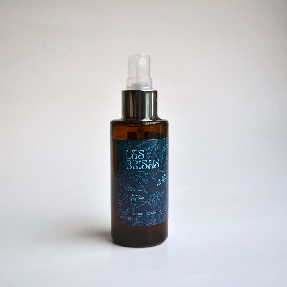 Perfume natural con aceites esenciales de ciprés, cedro y anís para energía equilibrada y aroma fresco
